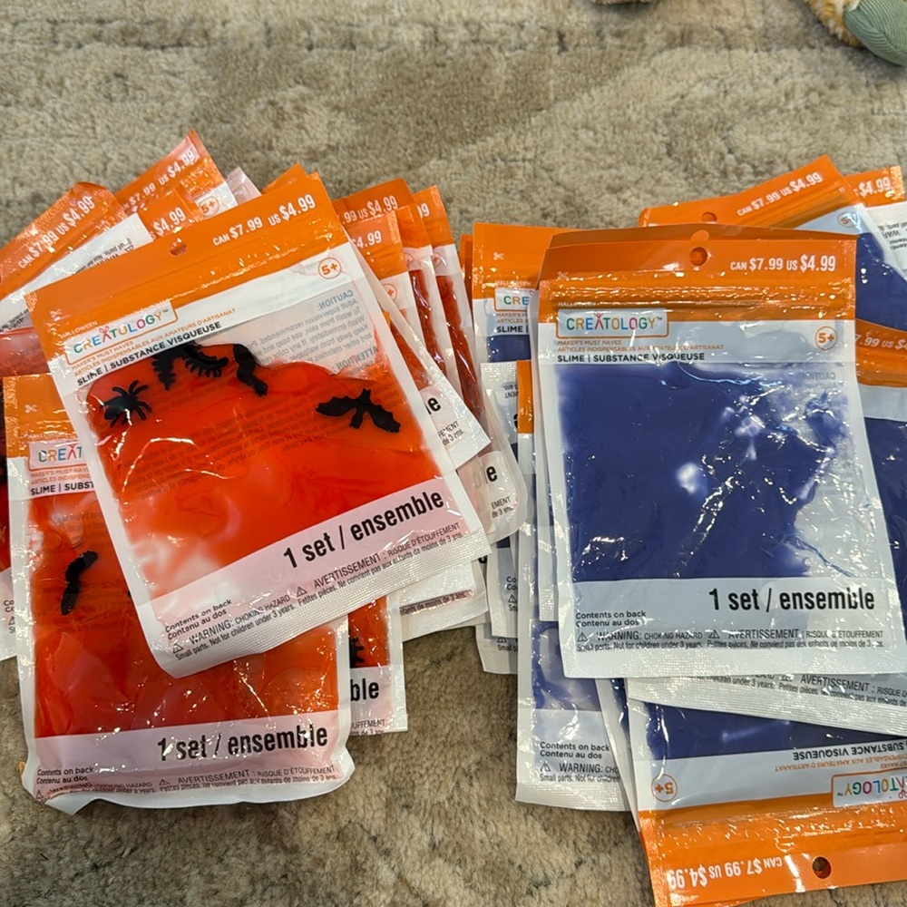 35 packets of Slime with creepy crawlers in it. 18 reddish and 17 Blue/purple.